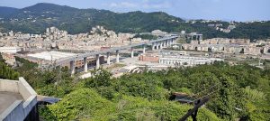 Panoramic view of the low steel-decked Genova San Giorgio bridge across the Polcevera valley