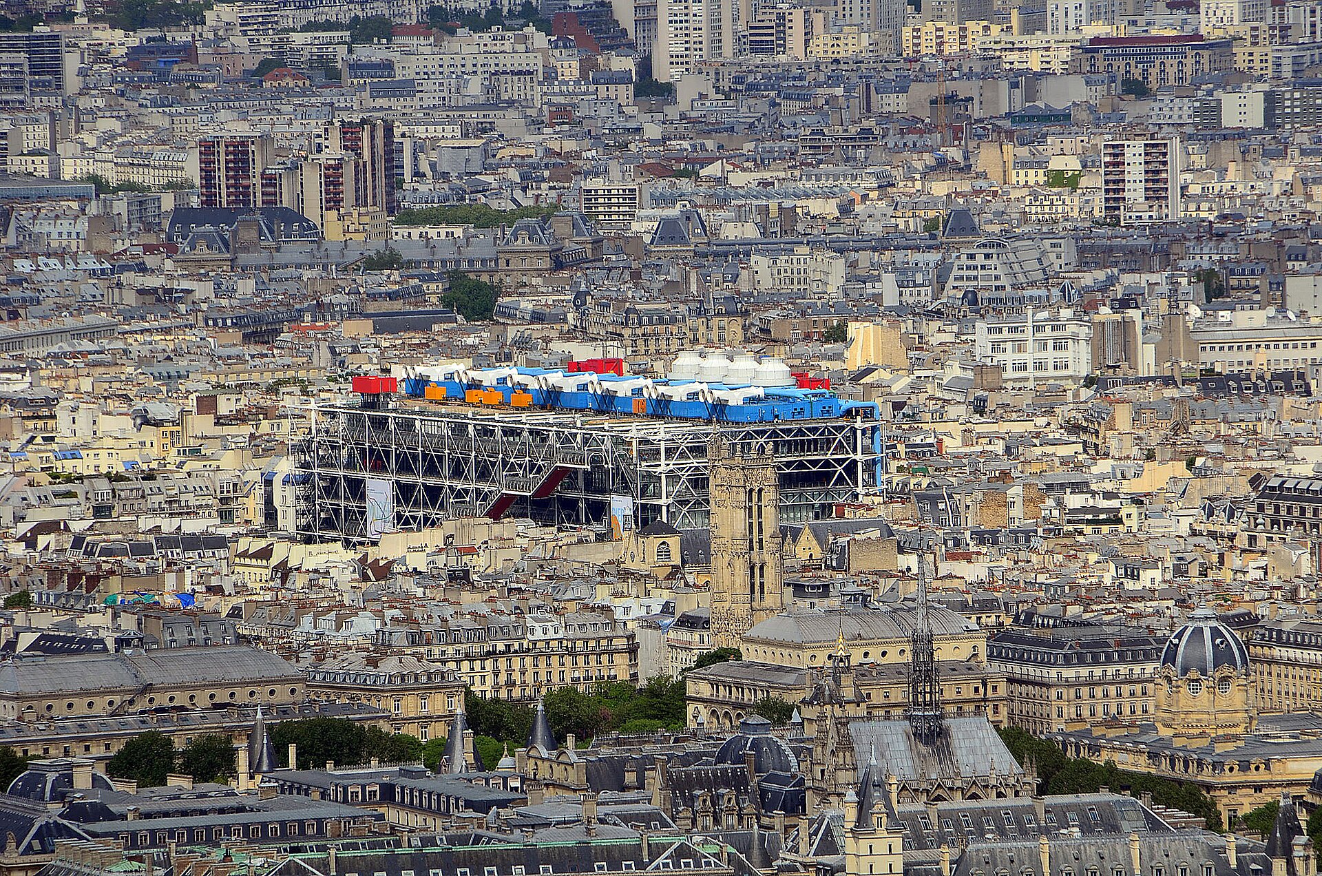 Exterior view of the Centre Pompidou in Paris with its coloured exposed pipework and escalators