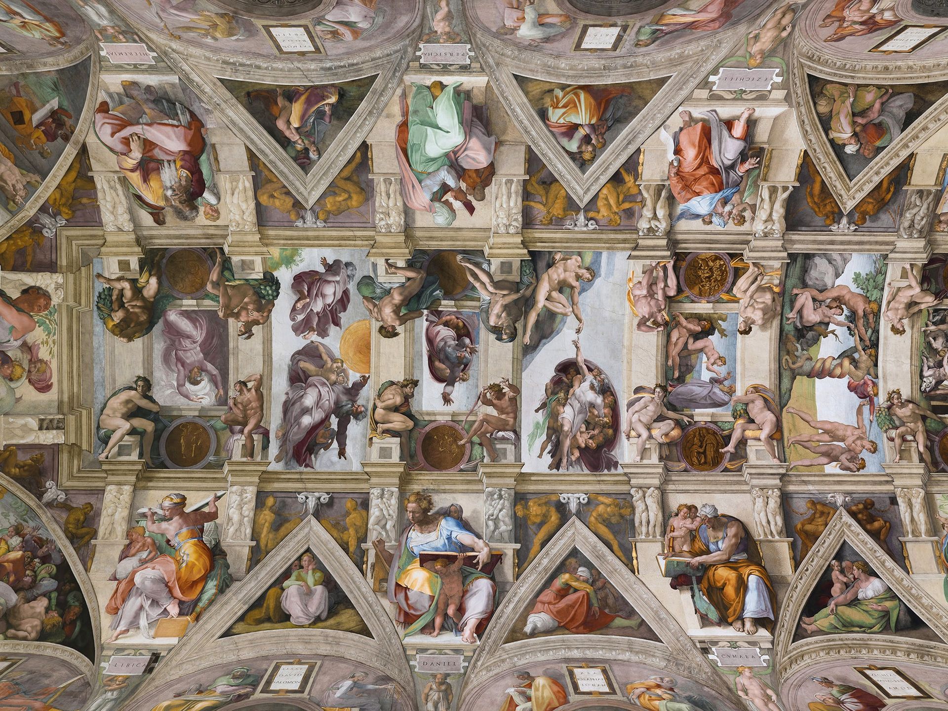 The painted ceiling of the Sistine Chapel showing Michelangelo's frescoed scenes and figures